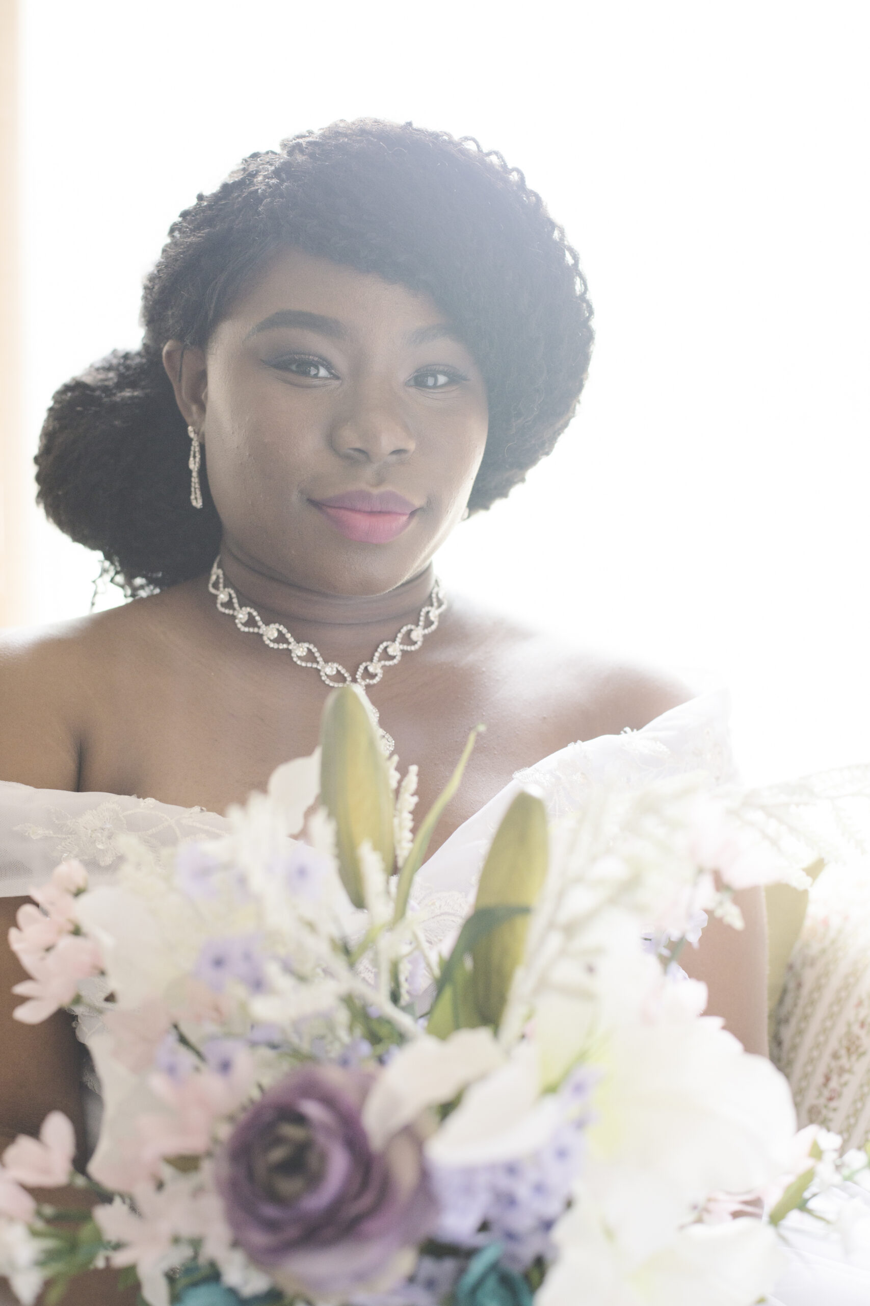 woman of color posing for her bridal portraits